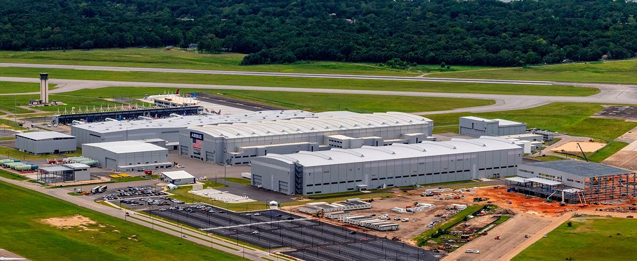 Airbus' Mobile production facility as illustrated in the corporate history brochure. The surrounding text discusses the 2015 opening; the photo is not assigned an unverified exposure date.
