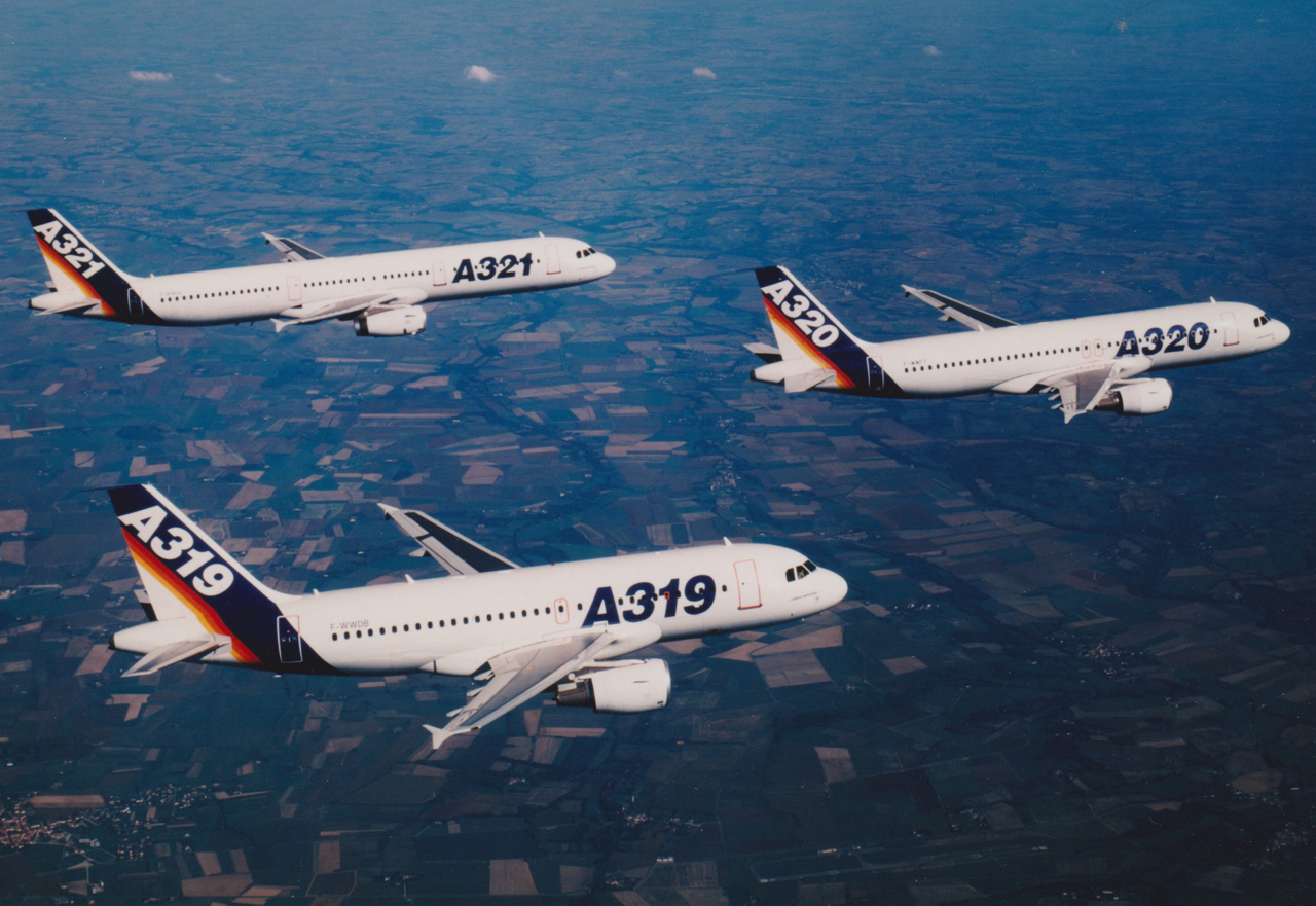 The original-engine A320 family in Airbus’s archive: A321 at upper left, A320 at upper right and A319 in the foreground.