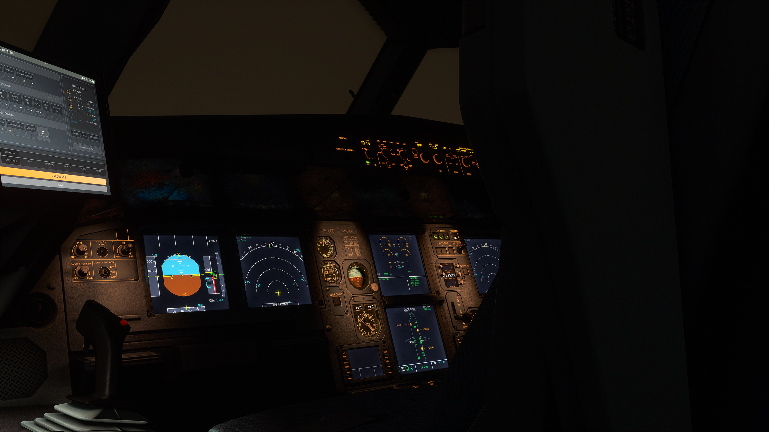 The May 2022 pre-release cockpit at night, with its original EFB and standby-instrument arrangement. Historical presentation reference; the displayed setup is not a V3 instruction.