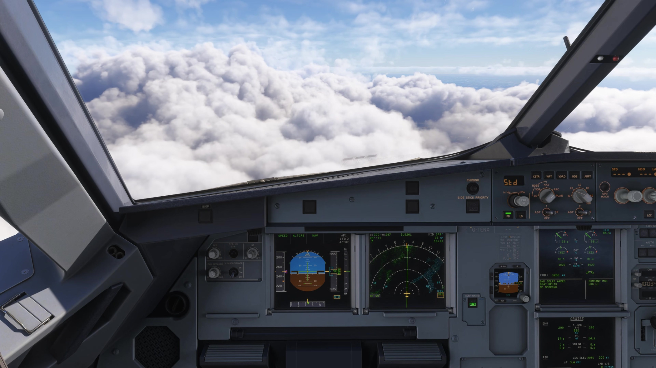 The V3 flight deck in level flight, with the PFD, navigation display and centre instruments in view.